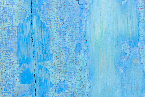 Blue Weathered and painted wooden texture background.