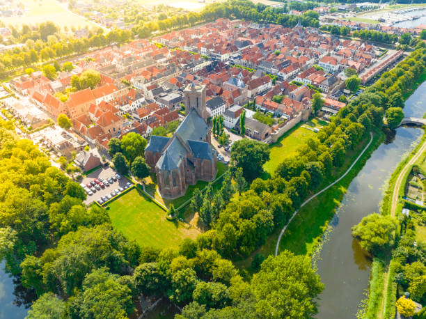 Elburg ancient walled town seen from above during a beautiful summer day in Gelderland, Netherlands. Elburg used to be a fishing town, but now is more focussed on tourism for its location close to the Veluwemeer and Veluwe as popular tourist destinations.