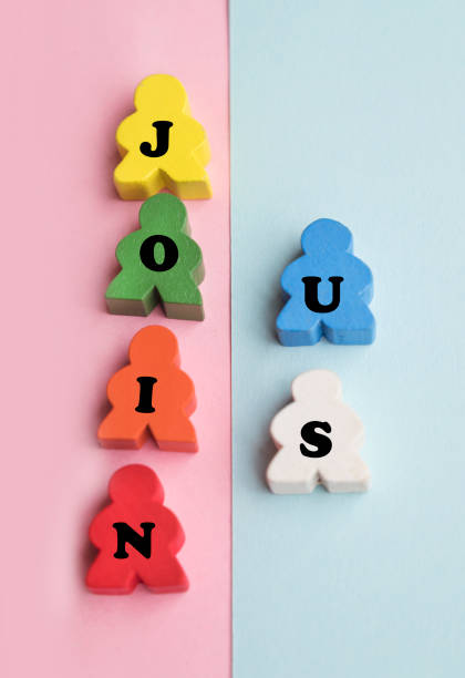 istock Join Us text written  on wooden people figurines 2010669834