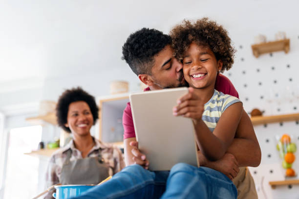 istock African family tablet and child learning at home with happiness, development, internet connection. 2010671080