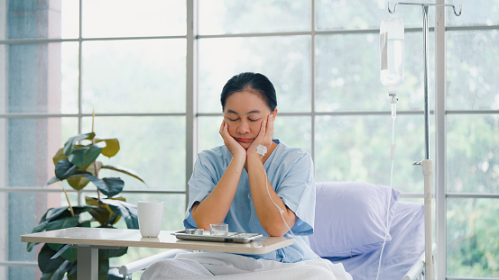 Senior female patient is lonely and bored while recuperating in the hospital.