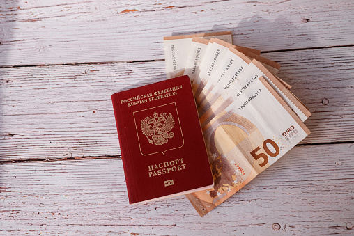 Passports on banknote background. Euro banknotes fifty. Traveling and money.