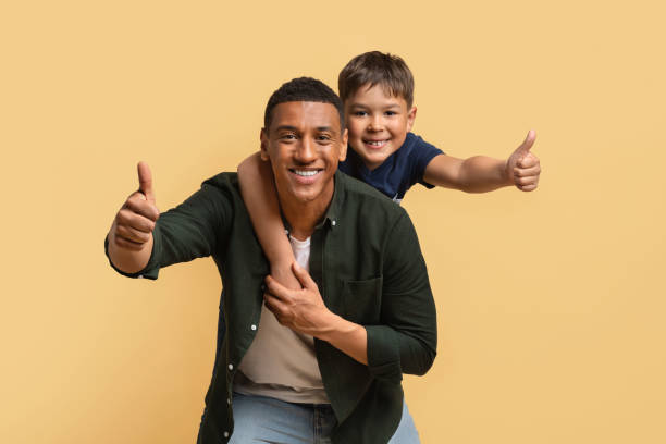 istock Happy black man have fun with his cute son 2010725089