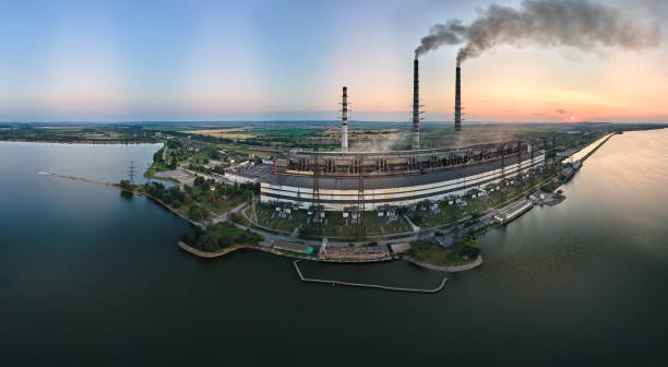 aerial view of coal power plant high pipes with black smokestack polluting atmosphere. electricity production with fossil fuel concept - vapor trail night sky sunset - fotografias e filmes do acervo