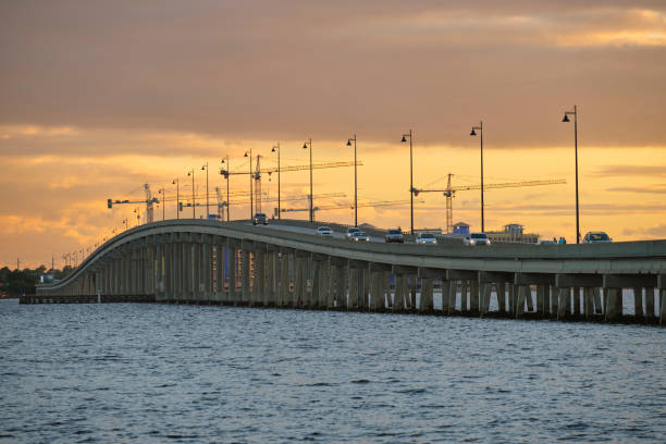 istock Barron Collier Bridge and Gilchrist Bridge in Florida with moving traffic. Transportation infrastructure in Charlotte County connecting Punta Gorda and Port Charlotte over Peace River 2010767194