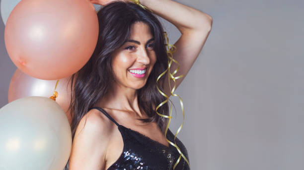 Happy beautiful woman with balloons . Birthday celebration
