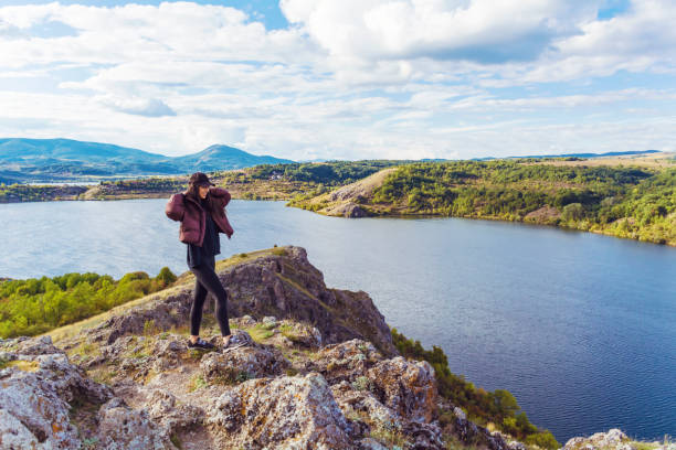 Traveler  Woman  in the summer  mountain with Lake .