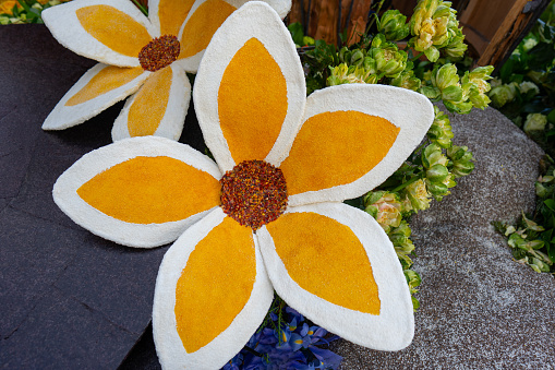 Large flower made of flowers for a Pasadena Rose Parade float.