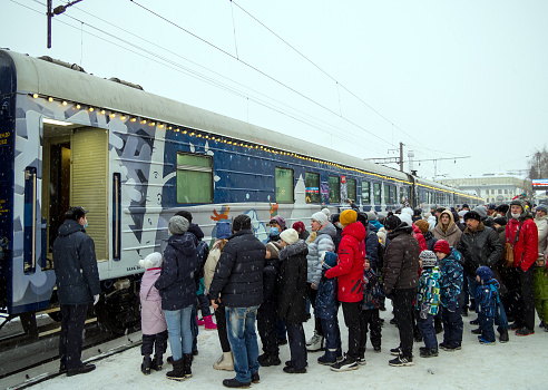 Voronezh, Russia - January 03, 2022: Queuing to visit the Santa Claus train