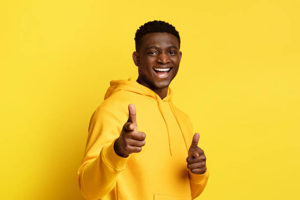istock Cool young handsome african american guy pointing at camera 2010805364
