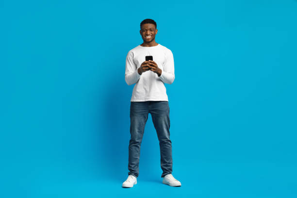 istock Happy young african american man using modern cell phone 2010805703