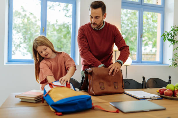 istock Father and daughter packing their bags 2010815949
