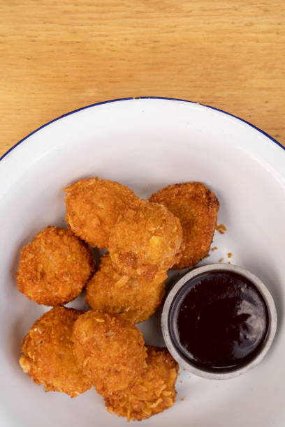 istock View of fried chicken croquettes with bbq sauce 2010857261