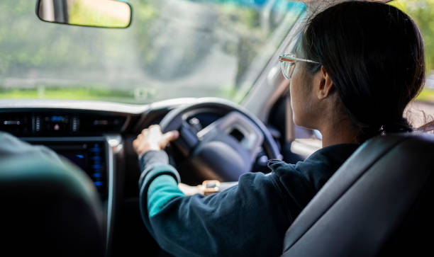 istock Young woman learning to drive a car 2010867368