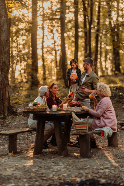 istock Family having a picnic in the forest in fall 2010869543