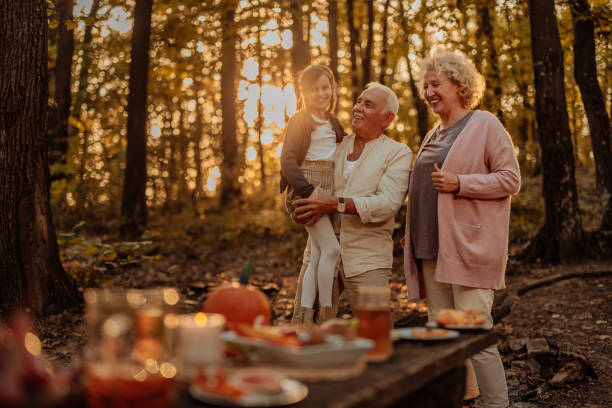 istock Family having a picnic in the forest on fall 2010879172