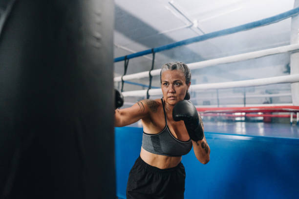 istock Boxer woman training on a boxing gym 2010879699