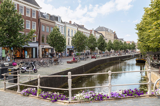 Leeuwarden, Netherlands, August 15, 2023; Shopping street along the canal in the center of Leeuwarden.