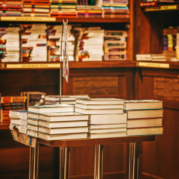 istock Bookstore with books on table and shelves. Education, school, study, reading concept 2010923789