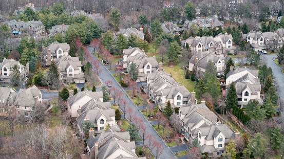 Aerial view of large town homes in affluent neighborhood.