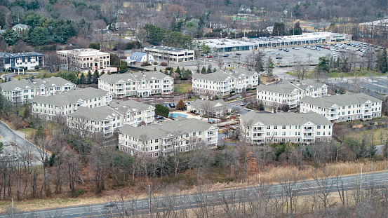 Aerial view of large apartments in affluent neighborhood in winter month.