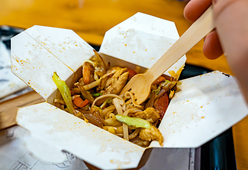 Wok box with shrimp, chicken and vegetables.
