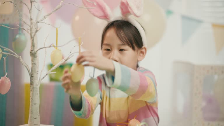 young girl was making Easter craft and decorations at home