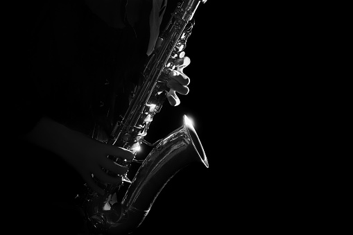 Saxophone Player Saxophonist playing jazz music. Sax alto Jazz Musician hands closeup