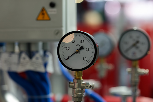 Pressure gauges and fire extinguishing equipment. Selective focus.