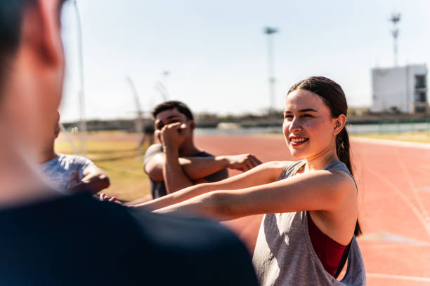 istock Athletes talking and stretching on track and field stadium 2011004143