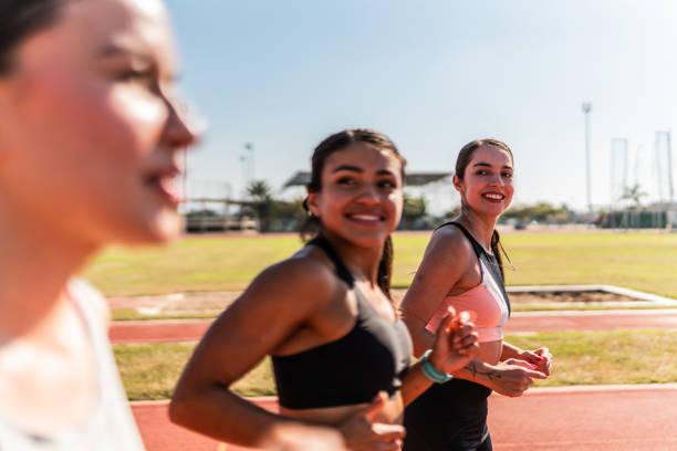 istock Athlete women training together on track and field stadium 2011012010