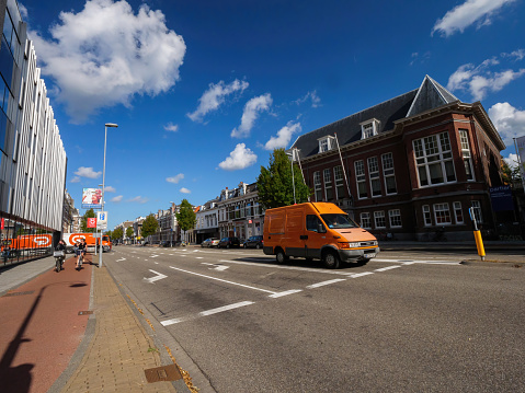 The Netherlands - Aug 19, 2018: Brand-new IVECO van from the Dutch post driving to deliver the parcels letters