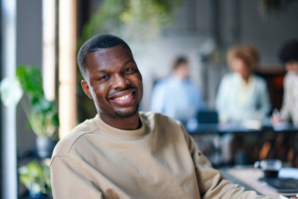 istock Happy African American Man Smiling in Office Environment 2011075790