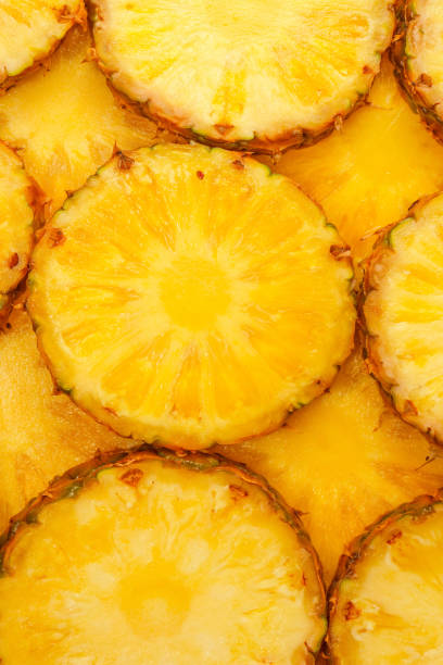 istock Pineapple juicy yellow slices as a background. 2011079539