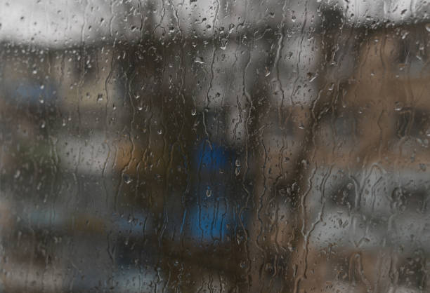 istock drops on the glass. raindrops on the window on a rainy day 2011089506