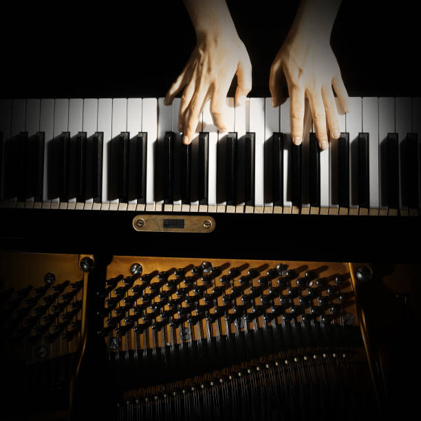 istock Piano keyboard hands. Pianist playing piano keys closeup 2011103633