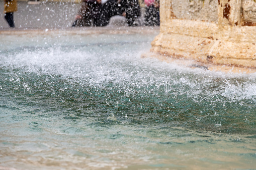 Close-up of a fountain's vigorous water spray, capturing the dynamic movement and the power of water