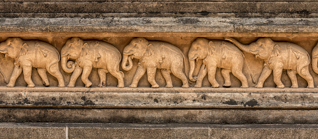 Ornate shape of an elephant head made of embellished glass layers
