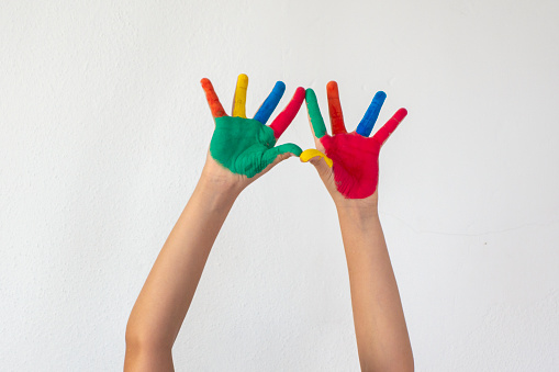 Boy Showing Colorful Paint on His Hands.