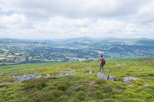 Hiker Backpacker on the mountain of Abergavenny, wales, England, summer outdoor