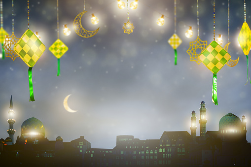 Ramadan Kareem greeting. Islamic lantern near mosque with night sky with crescent moon and stars. End of fasting. Hari Raya card. Eid al-Fitr decoration. Breaking of holy fast day. Muslim holiday.