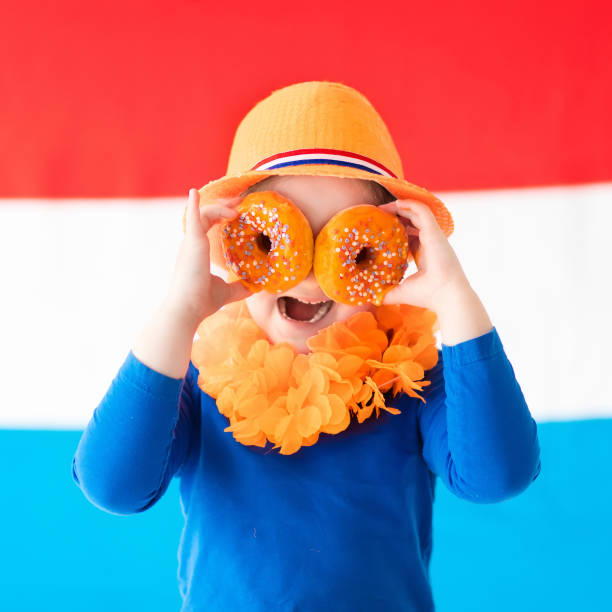 istock Kids supporting Netherlands sport team 2011211779