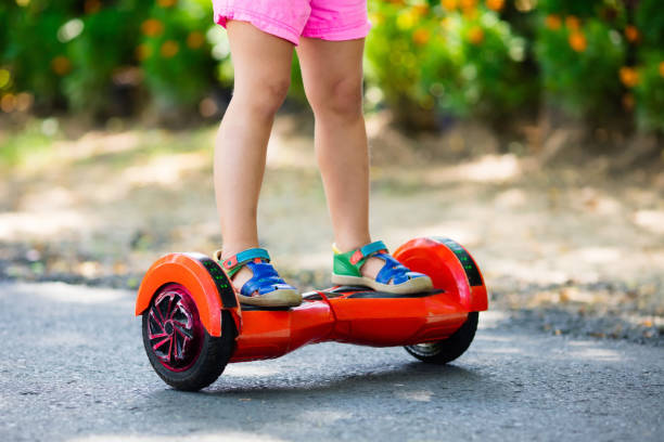 istock Child on hover board. Kids ride scooter. 2011219531