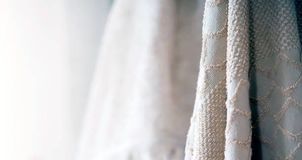 istock Background with a cotton fabric hanging in the light room. 2011242293