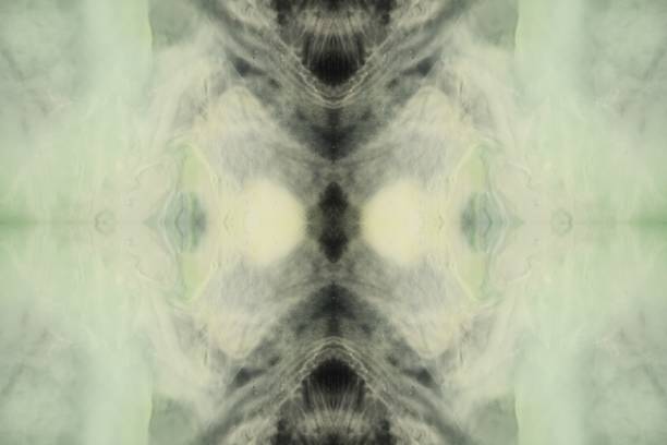 Mirrored from an extreme closeup of fluids dancing together.  Elegant. Excellent background for words or images. Lovely
