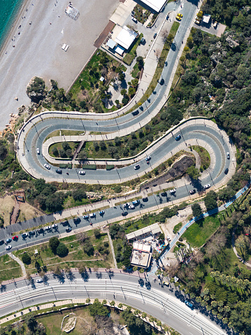 Aerial view of curved road in the coastal area. Antalya, Turkey. Taken via drone.