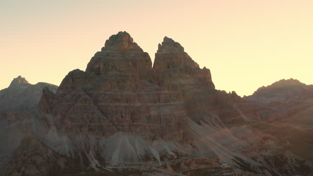 Sunrise reveals the mountainous terrain adorned with the majestic Three Peaks of Lavaredo
