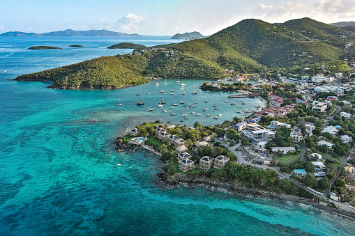 An aerial image above Cruz Bay on the issland of St. John, located in the US Virgin Islands.  The British Virgin Islands can be seen in the background. Image captured during sunrise.