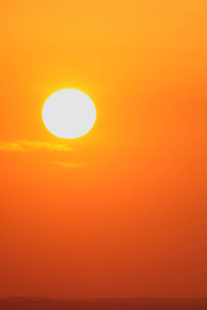 Red sunset with clouds on the sky background. Sky with clouds and sun
