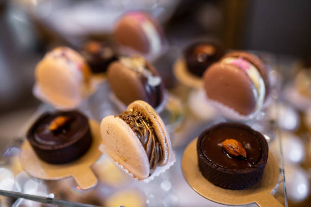 istock beautiful chocolate cakes and caramel macaroons for the holiday. 2011486699